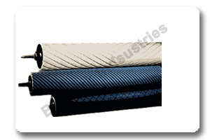 Rubber grooved spreader roll